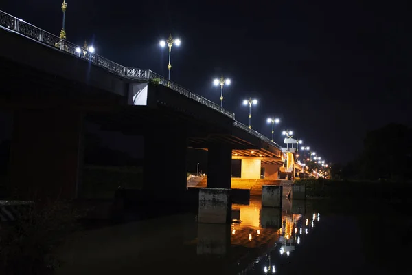 Landscape and colorful lighting and lamp at phaya mengrai bridge road on Thanon Klang Wiang street crossover Kok River in night time at Chiangrai city in Chiang Rai, Thailand