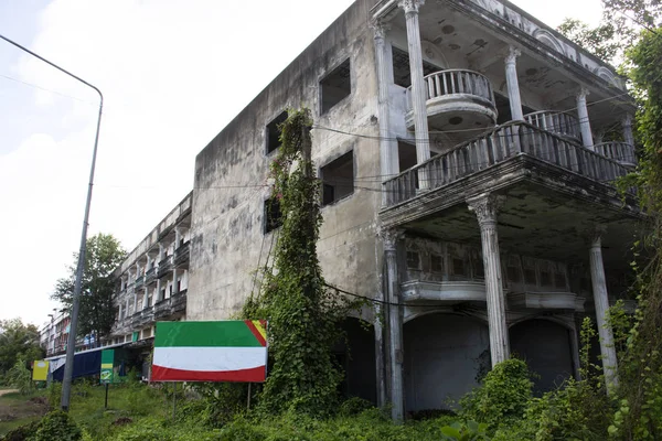 Abandoned house and old commercial building beside Ban Phe road at Banphe village city in Rayong, Thailand