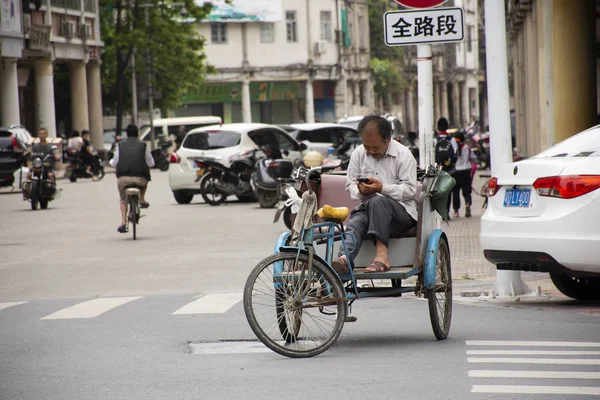 Chinese people drive and ride and bike on the road and foreigner — Stock Photo, Image