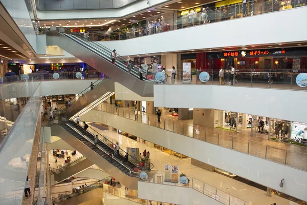 Chinese and foreigner people walking and use escalator for movin — Stock Photo, Image