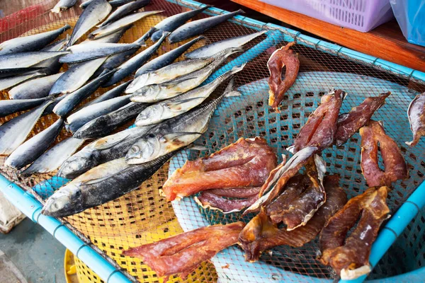 Dried sun fish for food preserves on wire sieve at outdoor for sale customer in local market shop of Ban Bang Krachao fishing village at Samut Sakhon, Thailand