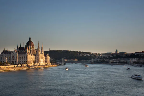 View landscape and cityscape of Budapest old town city and Hungarian Parliament with tour cruises in Danube Delta river and Budapest Chain Bridge in Budapest, Hungary