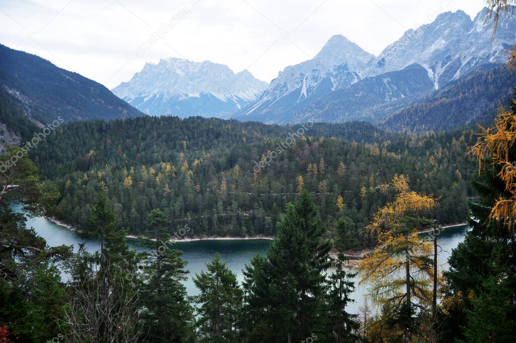 Austrian people and foreign travelers rest and dining at Rasthaus Zugspitzblick restaurant and visit viewpoint of Blindsee lake at Fernpass mountain pass of Tyrolean Alps in Biberwier, Austria