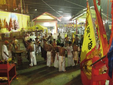 Shaman oracle thai people pilgrim join merit rite ritual medium invoker possession spirits of traditional chinese deity angel god goddess at Vegetarian Festival on October 20, 2012 in Phuket, Thailand