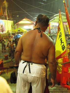 Shaman oracle thai people pilgrim join merit rite ritual medium invoker possession spirits of traditional chinese deity angel god goddess at Vegetarian Festival on October 20, 2012 in Phuket, Thailand