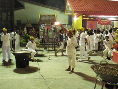 Shaman oracle thai people pilgrim join merit rite ritual medium invoker possession spirits of traditional chinese deity angel god goddess at Vegetarian Festival on October 20, 2012 in Phuket, Thailand