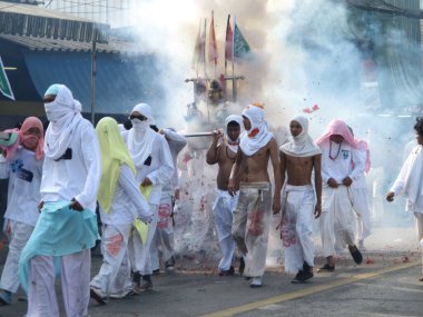 Shaman mediums thai people pilgrim join merit rite ritual medium invoker possession spirit of traditional chinese deity angel god goddess at Vegetarian Festival on October 20, 2012 in Phuket, Thailand
