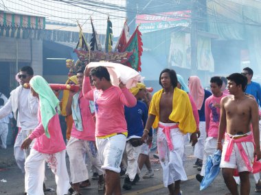 Shaman mediums thai people pilgrim join merit rite ritual medium invoker possession spirit of traditional chinese deity angel god goddess at Vegetarian Festival on October 20, 2012 in Phuket, Thailand