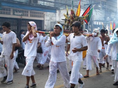 Shaman oracle thai people pilgrim join merit rite ritual medium invoker possession spirits of traditional chinese deity angel god goddess at Vegetarian Festival on October 20, 2012 in Phuket, Thailand