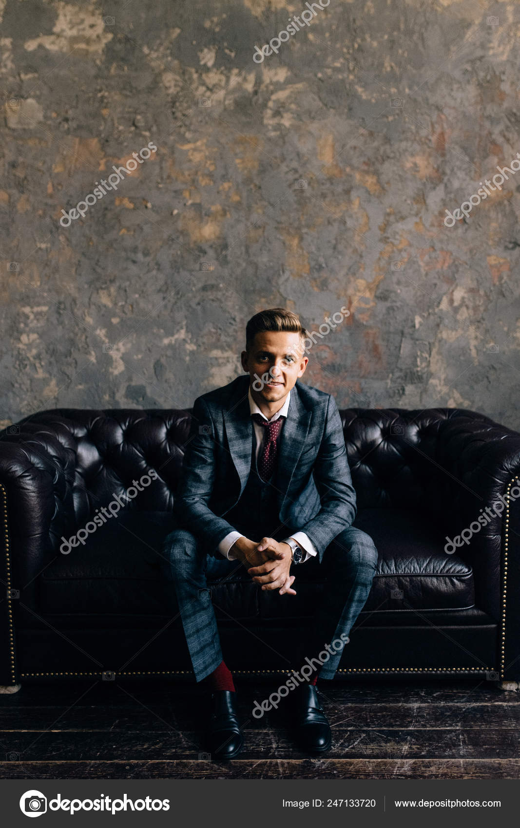 Male Model Posing In Studio While Arranging His Jacket Stock Photo -  Download Image Now - iStock