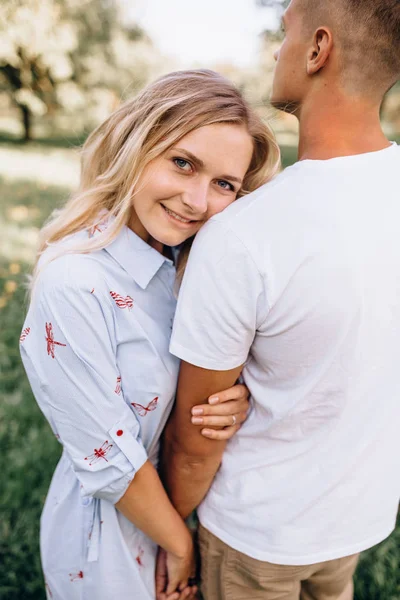 Portrait happy young smiling couple in love over flowering sprin — Stock Photo, Image