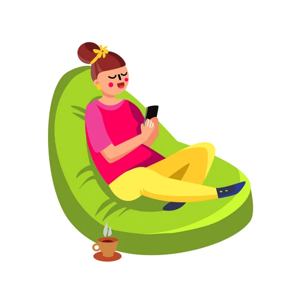 Girl Sitting In Beanbag And Using Cell Phone Vector — Stock Vector