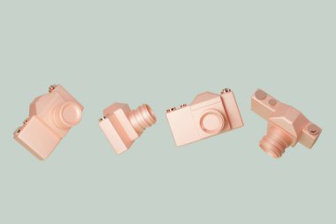 Pastel yeşil arka planda yüzen klasik bakır fotoğraf makinesi. Kameralar farklı açılarda, fotoğrafçılık modası. 3d illüstrasyon, kopyalama alanı ile 3d görüntüleme