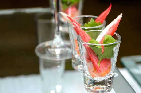 Crab sticks on a cocktail glass at a party