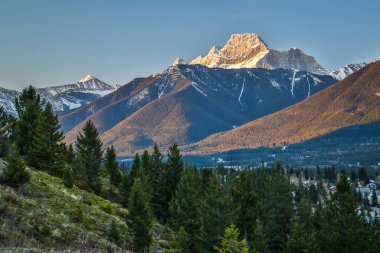 Mt. Laugheed view from Benchlands terrace viewpoint in Canmore, Canada, springtime view of canadian rockies, the last snow in Canada clipart