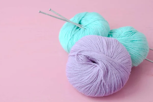 Premium Photo  Large knitting needles are stuck in a large ball of blue  yarn.
