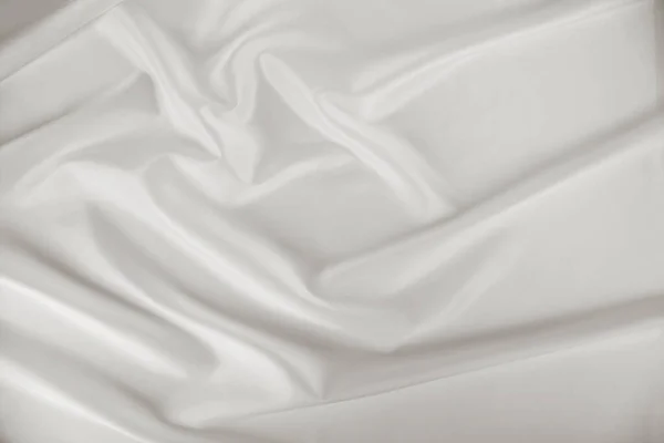 Detailní Záběr Bílé Skládané Hedvábné Tkaniny Pro Pozadí — Stock fotografie