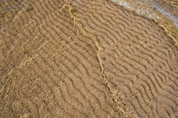 Padrão Ondas Areia Sob Água — Fotografia de Stock