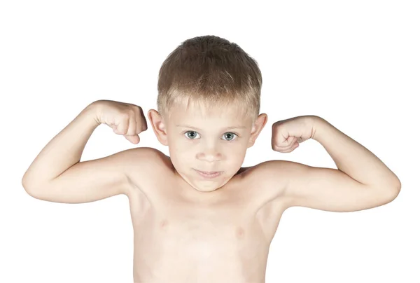Niño pequeño está mostrando sus músculos del brazo — Foto de Stock