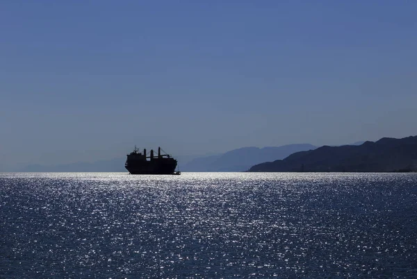 Silhouette of a ship in the Gulf of Aqaba of the Red Sea