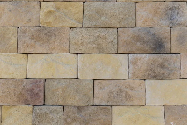 La textura de la pared de una variedad de piedras de colores —  Fotos de Stock