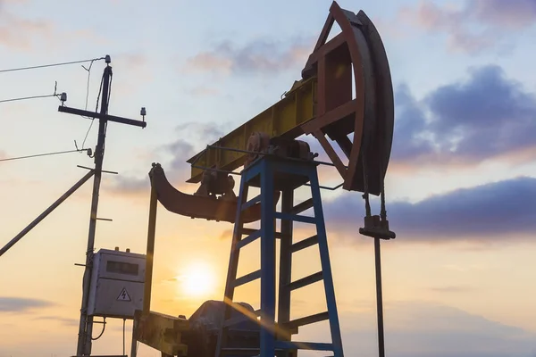 Oil rocking at sunset — Stock Photo, Image