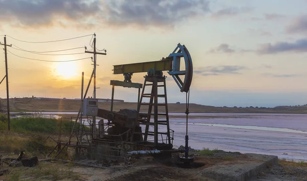 Oil rocking at sunset — Stock Photo, Image