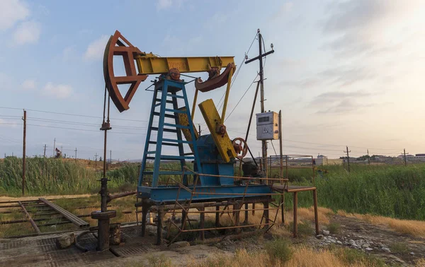 Oil rocking at sunset — Stock Photo, Image