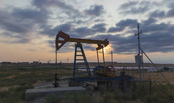 Oil rocking at sunset — Stock Photo, Image