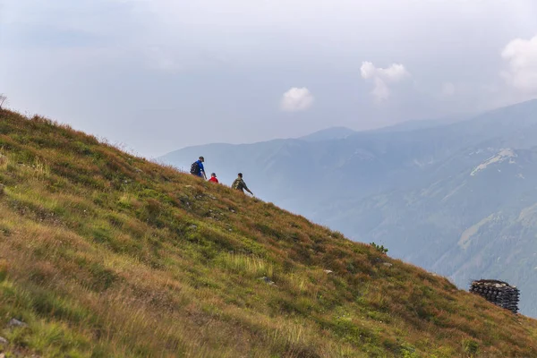 Tourists walking along the ridges of the mountains in the Tatras