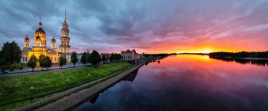 Panorama of Rybinsk on sunset with Volga river and Savior Transfiguration Cathedral, Yaroslavl Oblast, Russia clipart