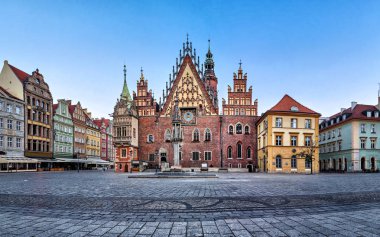 Gothic facade with astrinomical clock of old Town Hall in Wroclaw, Poland clipart