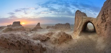Panoramic view of abandoned ruins of ancient Khorezm fortress Ayaz Kala in Kyzylkum desert, Uzbekista clipart