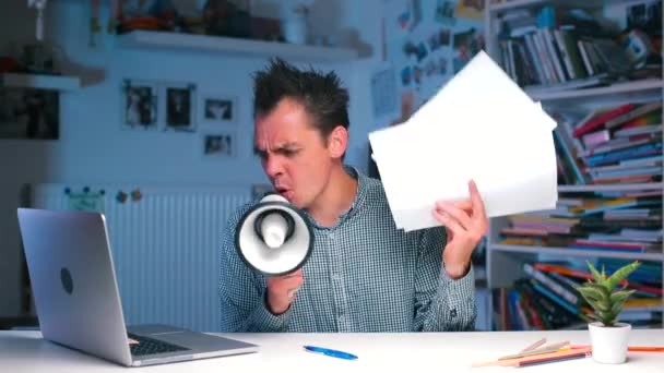 Aggressive manager shouting into a megaphone and waving documents — Stock Video