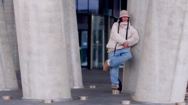 The video features a vibrant urban scene with diverse individuals a connected couple, a reflective man, a stylish woman in motion, and a casual man by a column