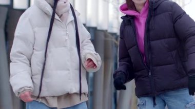 A vibrant city scene features a confident woman in a white jacket, a chatting couple, friends holding hands, and potential connections