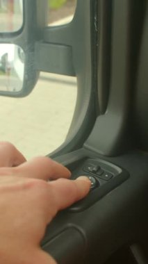 This video explores tech in transportation, starting with a person activating features in a car, then typing inside, showing digital integration in modern driving