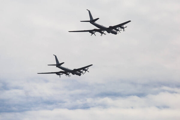 A squadron formation of russian attack aircrafts in the air, russian aerospace forces, with fighter planes, bombers and interceptor