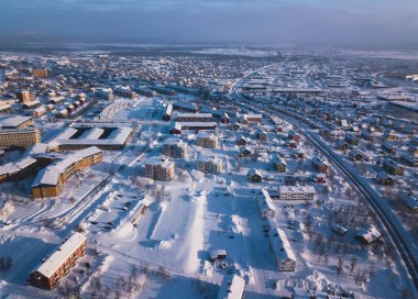 Aerial winter view of Kiruna, the northernmost town in Sweden, province of Lapland, winter sunny picture shot from drone clipart