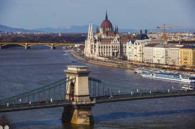 View of Hungarian Parliament Building, Budapest Parliament exterior, also called Orszaghaz, with Donau river and city panoram clipart