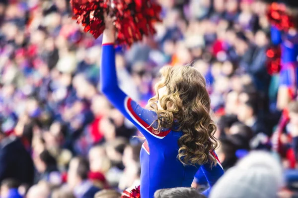 Female Cheerleader Red Blue Uniform Pom Pom Audience Background Performing — Stock Photo, Image