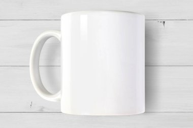 Beyaz 11 ons 'un yüksek açılı görüntüsü. Kahve fincanı modern beyaz ahşap arka planda dinleniyor..