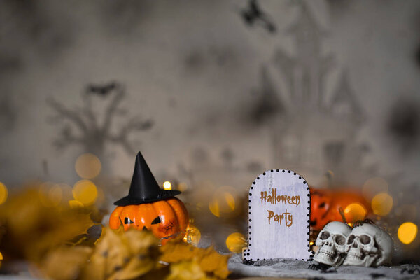 Halloween Party. Grave and two skulls. Halloween background