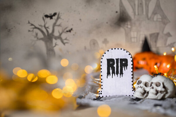 Grave and two skulls. Halloween background