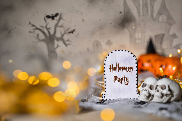 Grave and two skulls. Halloween background