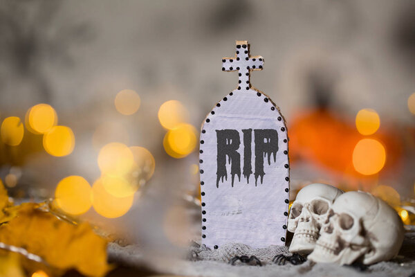 Grave and two skulls. Halloween background