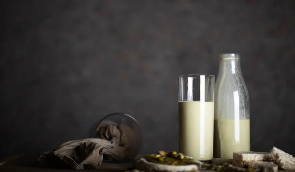 Homemade pistachio nut milk in a glass bottle. — Stock Photo, Image