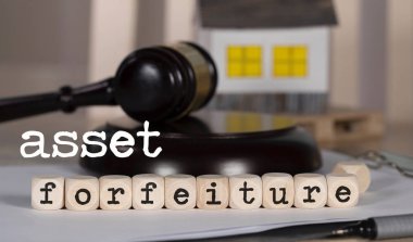 Words  ASSET FORFEITURE composed of wooden dices. clipart