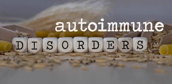 Words AUTOIMMUNE DISORDERS  composed of wooden dices. — Stock Photo, Image
