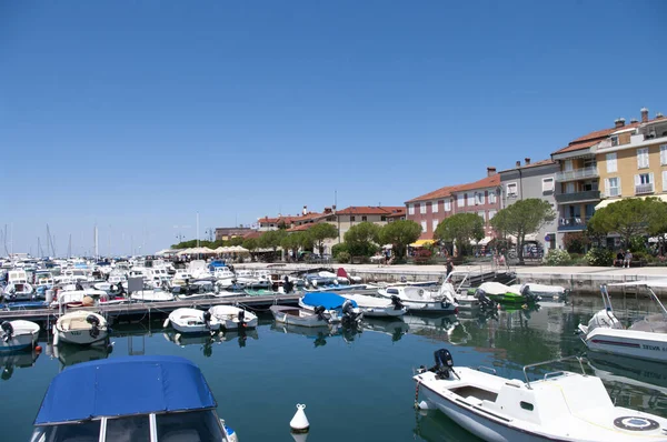 IZOLA, SLOVENIA - JULY 16, 2020: Marina Izola-valobran. Yachts and boats parked at dock. piers in centre of town. Izola, Slovenia. — Stock Photo, Image